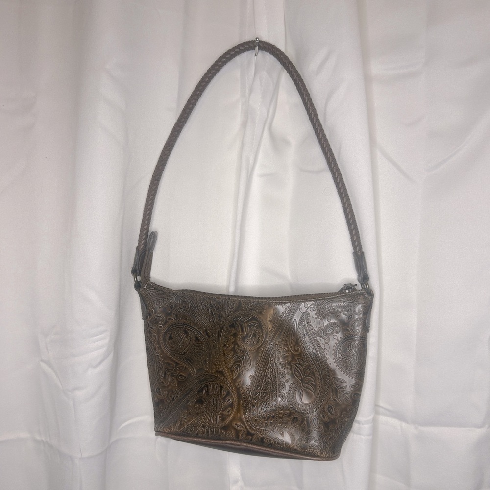 Relic tooled “leather” bag